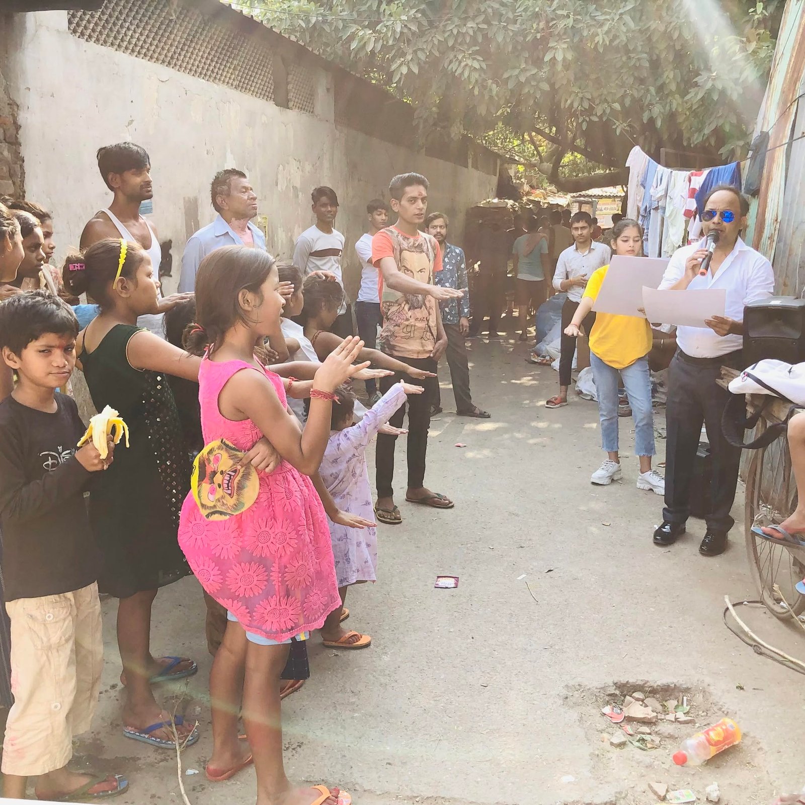 Children and community members participating in an awareness pledge